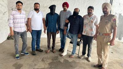 The two criminals (masked) after they were caught heading to Bathinda city to extort money from a businessman. Parminder Singh is a proclaimed offender in a case of criminal intimidation and Sushil Kumar is facing two cases under the Arms Act. (HT Photo) The two criminals (masked) after they were caught heading to Bathinda city to extort money from a businessman. Parminder Singh is a proclaimed offender in a case of criminal intimidation and Sushil Kumar is facing two cases under the Arms Act. (HT Photo)