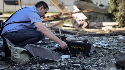 FILE PHOTO: A war crimes prosecutor works at a site of a Russian drone attack, amid Russia's attack on Ukraine, on the outskirts of Lviv, Ukraine June 19, 2024. REUTERS/Roman Baluk/File Photo (REUTERS)