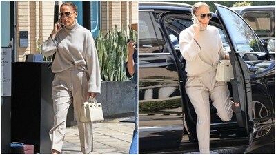 Jennifer Lopez stuns in a luxe ensemble while shopping in Los Angeles, wearing a muted-toned outfit featuring an oversized sweater, straight-fit pants, a chic handbag, and transparent heels. (Instagram) Jennifer Lopez stuns in a luxe ensemble while shopping in Los Angeles, wearing a muted-toned outfit featuring an oversized sweater, straight-fit pants, a chic handbag, and transparent heels. (Instagram)