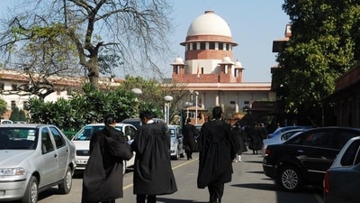 Lawyers outside the Supreme Court. (PTI Photo) Lawyers outside the Supreme Court. (PTI Photo)