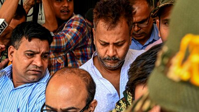 Kolkata: Arrested former Principal Sandip Ghosh (back) being taken by the CBI officials to a court in connection with R G Kar Medical College and Hospital rape and murder case, in Kolkata, Tuesday, Sept. 17, 2024. (PTI) Kolkata: Arrested former Principal Sandip Ghosh (back) being taken by the CBI officials to a court in connection with R G Kar Medical College and Hospital rape and murder case, in Kolkata, Tuesday, Sept. 17, 2024. (PTI)