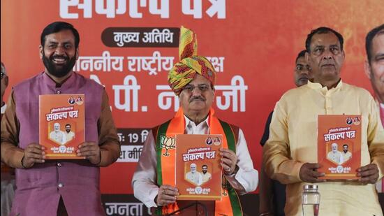 Union minister and BJP national president JP Nadda with Haryana chief minister Nayab Singh Saini and state BJP president Mohan Lal Badoli in Rohtak on Thursday. (PTI)