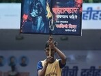 Thane, India - August 27, 2024: Govinda is seen holding a placard calling for death sentence for the accused in the Badlapur girls sexual assault case at the Dahi Handi festival in Thane at Sanskruti yuva Pratishan Dahihandi vartak nager in Thane. ( Praful Gangurde /HT Photo )