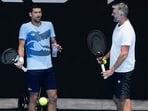 Novak Djokovic and Goran talk during a session. Novak Djokovic and Goran talk during a session.