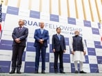 (FILES) US President Joe Biden (2nd-L), Japanese Prime Minister Fumio Kishida (2nd-R), Indian Prime Minister Narendra Modi (R) and Australian Prime Minister Anthony Albanese (L) announce the Quad Fellowship, a scholarship program that will bring together American, Japanese, Australian and Indian masters and doctoral students in science, technology, engineering, and mathematics (STEM) to study in the United States, during the Quad Leaders Summit at Kantei in Tokyo on May 24, 2022. Biden will host the leaders of allies Australia, India and Japan in his hometown of Wilmington, Delaware on September 21, 2024, for talks focused on tensions with China, the White House said on September 12. (Photo by Yuichi Yamazaki / POOL / AFP)