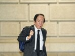 Bank of Japan (BoJ) governor Kazuo Ueda arrives at BoJ headquarters to attend a monetary policy meeting in central Tokyo.