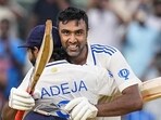 Ravichandran Ashwin celebrates his century with Ravindra Jadeja. Ravichandran Ashwin celebrates his century with Ravindra Jadeja.