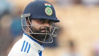 Virat Kohli reacts as he leaves the field after losing his wicket on the second day of the first cricket test match between India and Bangladesh (AP) Virat Kohli reacts as he leaves the field after losing his wicket on the second day of the first cricket test match between India and Bangladesh (AP)