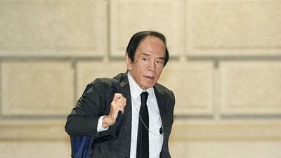 Bank of Japan (BoJ) governor Kazuo Ueda arrives at BoJ headquarters to attend a monetary policy meeting in central Tokyo. (AFP)