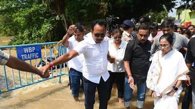 Large areas in at least 10 districts in West Bengal have been inundated and many rivers were flowing above danger mark. (PTI photo) Large areas in at least 10 districts in West Bengal have been inundated and many rivers were flowing above danger mark. (PTI photo)