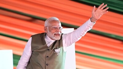 Prime Minister Narendra Modi waves towards the crowd during an assembly election rally at Sher-i-Kashmir Stadium in Srinagar,on Thursday. ( Waseem Andrabi /Hindustan Times)