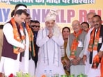 Union home minister Amit Shah acknowledges supporters at an election rally in Jammu and Kashmir.
