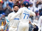Rishabh Pant celebrates his century with Shubman Gill. Rishabh Pant celebrates his century with Shubman Gill.