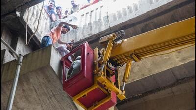 A fire tender’s crane being used to rescue the victim at the scene. (HT Photo) A fire tender’s crane being used to rescue the victim at the scene. (HT Photo)