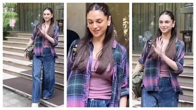Aditi Rao Hydari, the newly married bride, stepped out in a comfortable outfit. She wore a pink top and layered with an oversized plaid shirt that add to the effortless vibe to the entire ensemble. She paired it with a denim and white sneakers. This outfit is an inspiration for everyday outfit that is both comfortable and stylish. (Instagram/@varindertchawla) Aditi Rao Hydari, the newly married bride, stepped out in a comfortable outfit. She wore a pink top and layered with an oversized plaid shirt that add to the effortless vibe to the entire ensemble. She paired it with a denim and white sneakers. This outfit is an inspiration for everyday outfit that is both comfortable and stylish. (Instagram/@varindertchawla)