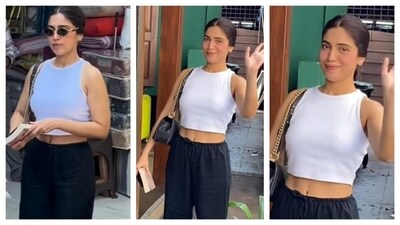 Bhumi Pednekar's day-out outfit exuded laid-back glam. In a simple white, sleeves white top, she accessorised with a black bag. She paired her top with loose-fitting black pants. The entire ensemble shows less is more. (Instagram/@bollywoodhelpline) Bhumi Pednekar's day-out outfit exuded laid-back glam. In a simple white, sleeves white top, she accessorised with a black bag. She paired her top with loose-fitting black pants. The entire ensemble shows less is more. (Instagram/@bollywoodhelpline)