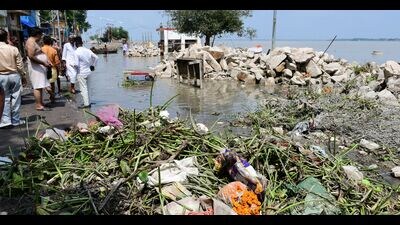 Receding water leaves behind waste in localities in Prayagraj (HT Photo)