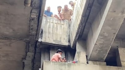 As a crane was brought to the site, the men lifted her and assisted the team in getting her into the crane for her descent on Saturday. (ANI) As a crane was brought to the site, the men lifted her and assisted the team in getting her into the crane for her descent on Saturday. (ANI)