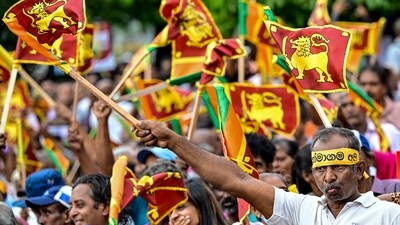 Supporters of Sri Lanka's president and United National Party presidential candidate Ranil Wickremesinghe during an election rally (Photo by Ishara S. KODIKARA / AFP) (HT_PRINT) Supporters of Sri Lanka's president and United National Party presidential candidate Ranil Wickremesinghe during an election rally (Photo by Ishara S. KODIKARA / AFP) (HT_PRINT)