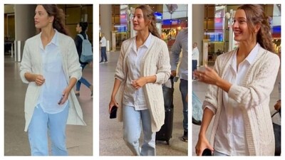 Triptii Dimri's airport look reminds us that chic layering never goes out of style. Wearing a simple white shirt, she layered it with a long white shrug and paired it with light blue denim jeans. She channeled effortless glam in this relaxed outfit of soft colors. (Instagram/@varindertchawla) Triptii Dimri's airport look reminds us that chic layering never goes out of style. Wearing a simple white shirt, she layered it with a long white shrug and paired it with light blue denim jeans. She channeled effortless glam in this relaxed outfit of soft colors. (Instagram/@varindertchawla)