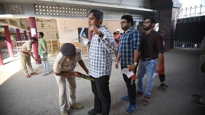 Police officials inspecting aspirants before entering the exam centre to appear for UPSC CSE mains exam. (Santosh Kumar ) Police officials inspecting aspirants before entering the exam centre to appear for UPSC CSE mains exam. (Santosh Kumar )