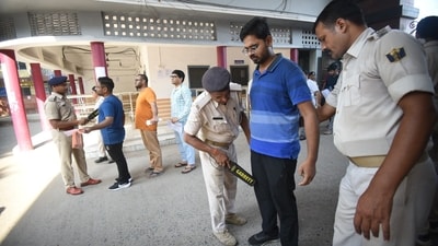 Applicants are inspected by a police person before entering the exam centre to appear for the Civil Services (Main) Examination in Patna. (Santosh Kumar ) Applicants are inspected by a police person before entering the exam centre to appear for the Civil Services (Main) Examination in Patna. (Santosh Kumar )