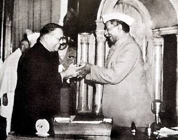 Dr BR Ambedkar presents the final draft of the Constitution to Dr Rajendra Prasad, the president of the Constituent Assembly, in 1949. (HT Archive) Dr BR Ambedkar presents the final draft of the Constitution to Dr Rajendra Prasad, the president of the Constituent Assembly, in 1949. (HT Archive)