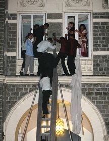 Taj Mahal Palace hotel staff help guests escape during the 26/11 terror attack in Mumbai. (MANOJ PATIL/HT ARCHIVE) Taj Mahal Palace hotel staff help guests escape during the 26/11 terror attack in Mumbai. (MANOJ PATIL/HT ARCHIVE)
