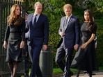 Britain's Prince William, second left, Kate, Princess of Wales, left, Britain's Prince Harry, second right, and Meghan, Duchess of Sussex view the floral tributes for the late Queen Elizabeth II outside Windsor Castle, in Windsor, England on Sept. 10, 2022. (AP Photo/Martin Meissner, File) Britain's Prince William, second left, Kate, Princess of Wales, left, Britain's Prince Harry, second right, and Meghan, Duchess of Sussex view the floral tributes for the late Queen Elizabeth II outside Windsor Castle, in Windsor, England on Sept. 10, 2022. (AP Photo/Martin Meissner, File)