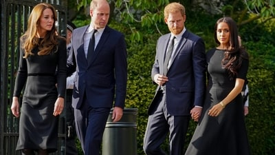 Britain's Prince William, second left, Kate, Princess of Wales, left, Britain's Prince Harry, second right, and Meghan, Duchess of Sussex view the floral tributes for the late Queen Elizabeth II outside Windsor Castle, in Windsor, England on Sept. 10, 2022. (AP Photo/Martin Meissner, File) (AP) Britain's Prince William, second left, Kate, Princess of Wales, left, Britain's Prince Harry, second right, and Meghan, Duchess of Sussex view the floral tributes for the late Queen Elizabeth II outside Windsor Castle, in Windsor, England on Sept. 10, 2022. (AP Photo/Martin Meissner, File) (AP)