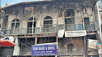 Just beside the doorway stands the 50-year-old showroom Ram Babu & Brothers, which specialises in “all school uniforms.” (HT Photo) Just beside the doorway stands the 50-year-old showroom Ram Babu & Brothers, which specialises in “all school uniforms.” (HT Photo)