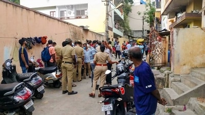 Police set up a blockade at the Bengaluru apartment where a woman’s body was found, initiating an investigation with forensic teams and canine units. (PTI) Police set up a blockade at the Bengaluru apartment where a woman’s body was found, initiating an investigation with forensic teams and canine units. (PTI)