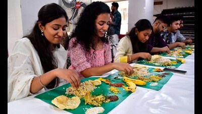 People enjoying traditional cuisine during Onam in Ludhiana on Sunday. (Manish/Hindustan Times)