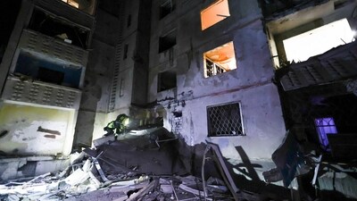 Emergency services workers look to move rubble and find injured after a Russian strike on a residential building in Kharkiv, Ukraine early Sunday Sept. 22, 2024. (Kharkiv Regional Military Administration via AP) (AP)