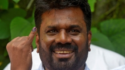 Anura Kumara Dissanayake, the presidential candidate from National People's Power, shows his ink-marked finger after casting his vote at a polling station, on the day of the presidential election, in Colombo, Sri Lanka, September 21, 2024. REUTERS/Stringer