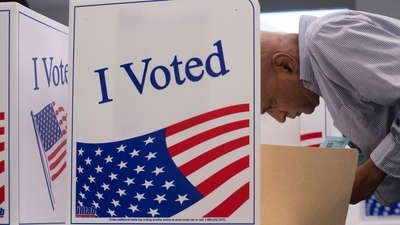 A voter works on his ballot at a polling station at theElena Bozeman Government Center in Arlington, Virginia, on September 20, 2024. Early in-person voting for the 2024 US presidential election began in Virginia, South Dakota and Minnesota. (Photo by AFP) (AFP) A voter works on his ballot at a polling station at theElena Bozeman Government Center in Arlington, Virginia, on September 20, 2024. Early in-person voting for the 2024 US presidential election began in Virginia, South Dakota and Minnesota. (Photo by AFP) (AFP)
