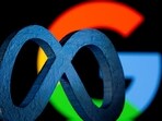 A 3D printed Facebook's new rebrand logo Meta is seen in front of displayed Google logo in this illustration.