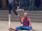Influencer in a Spider-Man costume sparks attention while begging at Kalyan Junction.