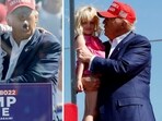 Donald Trump shares warm moments with his grandchildren at NC rally  (AP Photo/Chris Seward, photo by Anna Moneymaker / GETTY IMAGES NORTH AMERICA / Getty Images via AFP)