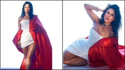 Shehnaaz Gill turns up the heat with her latest look in a white off-shoulder mini dress. Paired with a vibrant red overcoat and a choker necklace, she radiates sheer glamour. (Instagram/@shehnaazgill) Shehnaaz Gill turns up the heat with her latest look in a white off-shoulder mini dress. Paired with a vibrant red overcoat and a choker necklace, she radiates sheer glamour. (Instagram/@shehnaazgill)