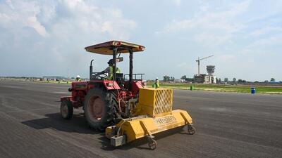 A view of the ongoing construction work on the 3.9km long northern runway of the Noida international airport in Jewar. (Sunil Ghosh/HT Photo)
