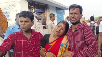 Family members of the victims react after the bodies of the fishermen were found on Sunday. (PTI)