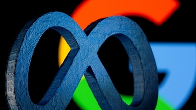 A 3D printed Facebook's new rebrand logo Meta is seen in front of displayed Google logo in this illustration. (Reuters)