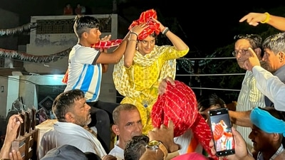 Congress candidate Vinesh Phogat being welcomed during her election campaign in Barah Khurd village in Jind district. (File) (PTI) Congress candidate Vinesh Phogat being welcomed during her election campaign in Barah Khurd village in Jind district. (File) (PTI)