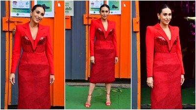 Karisma Kapoor proves her fashion prowess as she stuns in a vibrant red dress with power shoulders, embellished corset detailing, full sleeves, and a chic midi hemline. (HT photo/VarinderChawla) Karisma Kapoor proves her fashion prowess as she stuns in a vibrant red dress with power shoulders, embellished corset detailing, full sleeves, and a chic midi hemline. (HT photo/VarinderChawla)