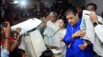 West Bengal chief minister Mamata Banerjee distributes relief materials to the victims of the flood-affected region, at Barjora in Bankura on Monday. (All India Trinamool Congress-X)