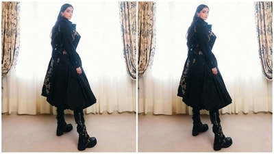 To add some contrast, she wore a half-floral embroidered jacket and thigh-high shiny boots that perfectly complemented her chic look. (Instagram/@rheakapoor)