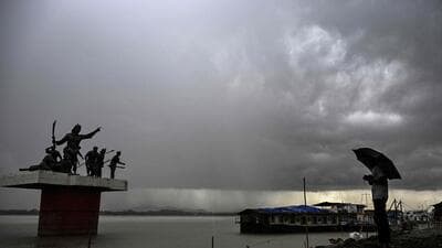 Dark clouds loom over the Brahmaputra River in Assam’s Guwahati on Tuesday. (AFP) Dark clouds loom over the Brahmaputra River in Assam’s Guwahati on Tuesday. (AFP)