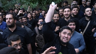 FILE -A demonstrator throws an egg at the Swedish Embassy during a protest for the desecration of the Quran in Sweden, July 21, 2023, in Tehran, Iran. (AP Photo/Vahid Salemi, File)