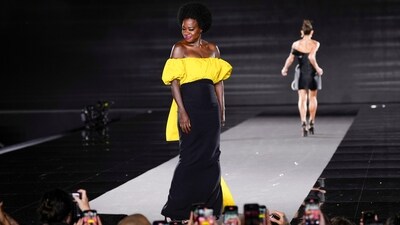 Viola Davis wears a floor-length gown featuring a striking canary yellow bodice, a figure-hugging black skirt, and a yellow bow at the back. (AP) Viola Davis wears a floor-length gown featuring a striking canary yellow bodice, a figure-hugging black skirt, and a yellow bow at the back. (AP)